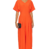 Model wearing a stylish modest midi dress with long sleeves and a high neckline in a subtle floral pattern.