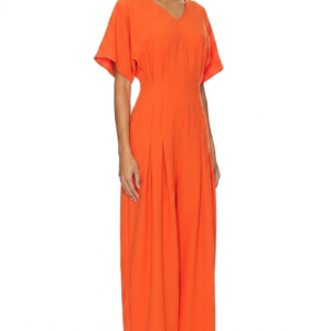 Model wearing a stylish modest midi dress with long sleeves and a high neckline in a subtle floral pattern.