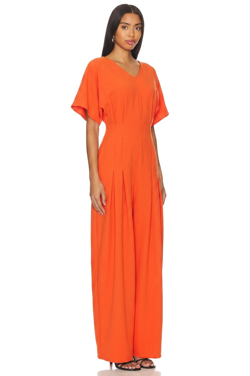 Model wearing a stylish modest midi dress with long sleeves and a high neckline in a subtle floral pattern.