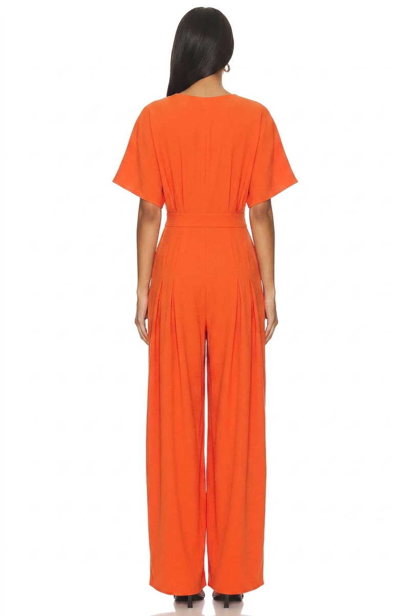Model wearing a stylish modest midi dress with long sleeves and a high neckline in a subtle floral pattern.