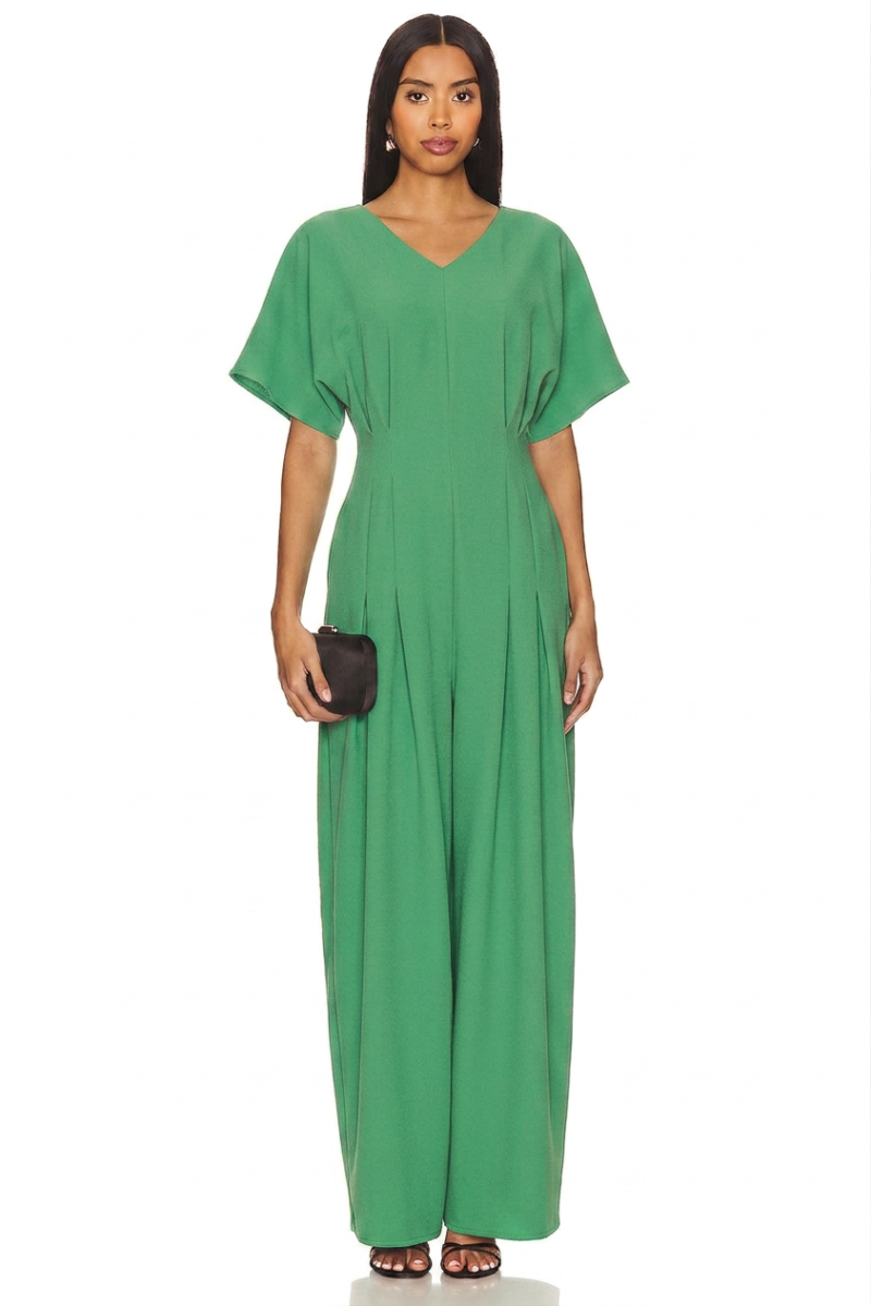 Model wearing a stylish modest midi dress with long sleeves and a high neckline in a subtle floral pattern. - green