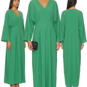 Elegant flowy black abaya with intricate embroidery details and a matching belt on a model in an outdoor setting. - green