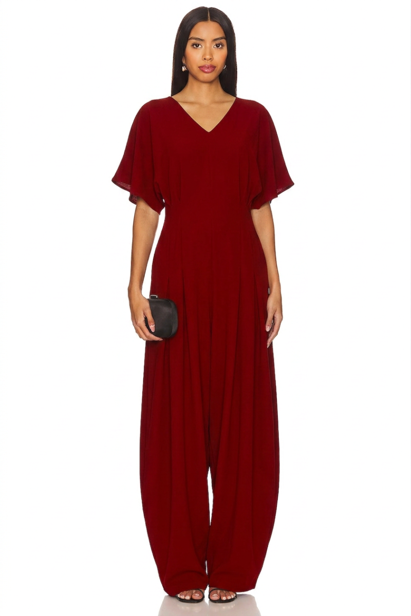 Elegant flowy black abaya with intricate embroidery details and a matching belt on a model in an outdoor setting. - red
